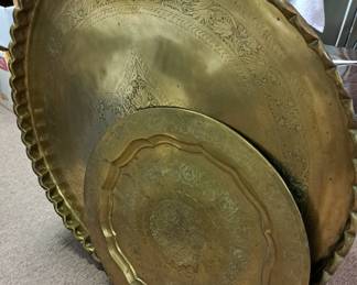 Much, much brass. Large brass serving trays/table