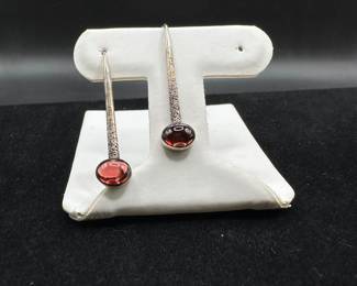 L12 - $75. Ed Levin Sterling with Orange/Pink Stone. Hangs 1.5". 