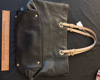 F94 - $50. Michael Kors shows minor wear on handles. 