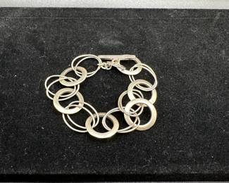 J62 - $25 Sterling Circles Bracelet. Measures 8" long. 