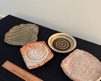 F145 - Left to Right. $15, $10, $10, $15. Rusty Sieck - Chicken Bridge Pottery. 