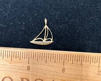 J16 - $45. 14kt gold sailboat charm. 