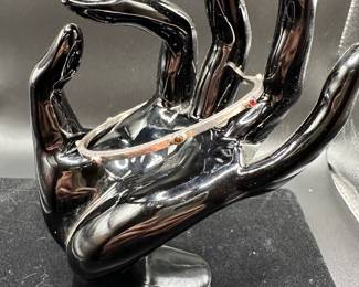 J46 - $25. "LM" Sterling Bangle with reddish stones. 