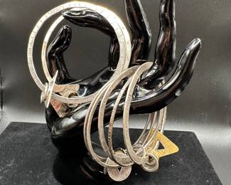 J41 - $140. Set of 7 Sterling Modernist Bracelets. 