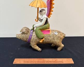 F48 - $20 Judie Bomburger Man on Pig. Resin