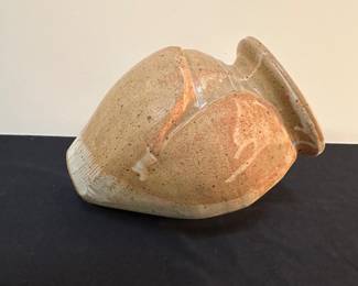 F30 - $25 Howe signed pottery vase. Can lay on it's side or stand. 