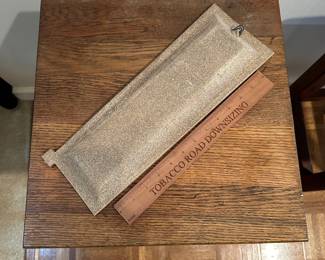 F11 - $25 signed pottery wall hanging. Measures 5" wide by 15" long.