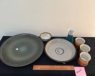 F33 & F34 - Pringle pottery. Left to right. F33 -$30 15" wall plate, F34 - $8 Small bowl, $20 Pie plate wall hanging, $10 vase, $15 for set of 3 mugs.