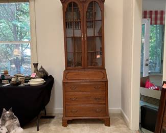 F182 - $175. Davis Two Piece Secretary Curio Cabinet. One back leg is broken and needs repair - otherwise very good condition!