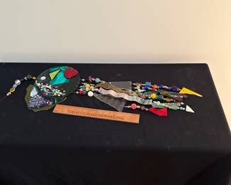 F44 - $40 signed "Susan BE" Art glass wind chime. Needs repair to hanger.