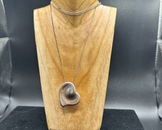 J60 - $150. Tiffany & Co. Elsa Peretti Full Heart necklace on 28" sterling Tiffany chain. 