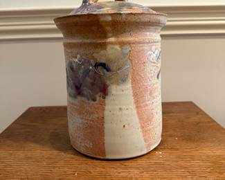 F9 - $25 Lidded canister by Stone Crow Pottery. Measures 10" tall. 