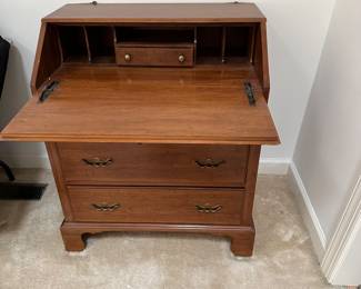 F182 - $175. Davis Two Piece Secretary Curio Cabinet. One back leg is broken and needs repair - otherwise very good condition!
