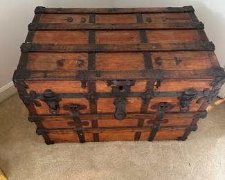 F118 - $95 - Antique Trunk. Measures 32" wide, 19.5" deep, 23.5" tall.