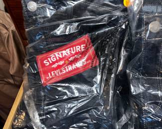 This is a representation of the bulk clothing which is still in its delivery bag or still has its tags on. 