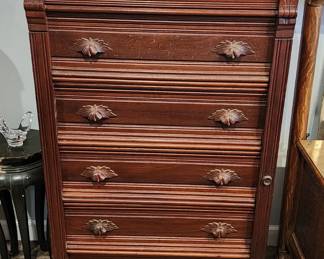 Chest of drawers with unique locking bar running down on the right side of the front