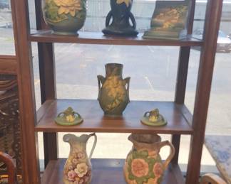 Roseville pottery pieces along with other pottery and glass pieces