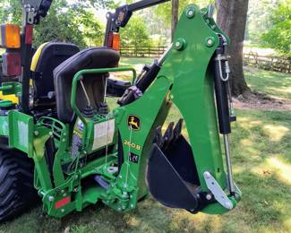 Back hoe attachment on tractor 