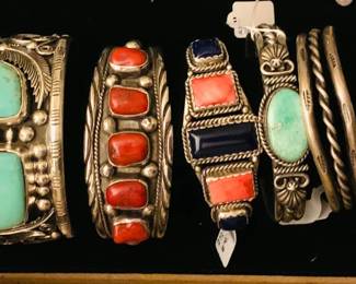 Closeup of Native American Sterling Silver Cuff Bracelets - Artist Signed