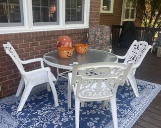 Outdoor table and chairs, rug for outdoors