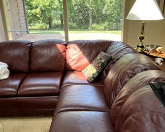 Wonderful comfortable Maroon leather sectional.  The entire family can sit on this comfortably...AND the middle section is a sleeper sofa!  You can't beat this!  Hurry out, this won't last long!