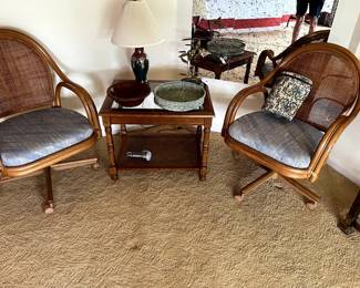 Great caned back Rattan chairs, with upholstered seats...SO comfortable!  On casters, and in very good condition, Cloisonne lamp and other pottery