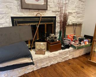 Looking at the fireplace, vintage 45's, vintage projector, books on tape