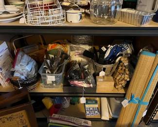 Lots of flatware and utensils, baking items, corks