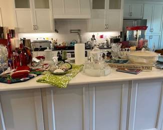 Looking at the kitchen island, great color glass, linens and a beautiful glass posy ring
