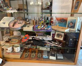 This is the large showcase were lots of great items can be found. Brownie Cameras, Compasses, Vintage Sears catalog and mugs, watches, Chevrolet emblem, 8 track Elvis, vintage comics