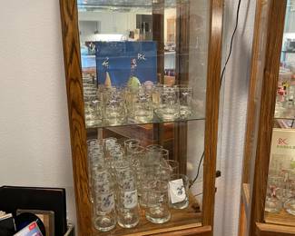 Collector series glasses displayed in lighted show case. (Show case not for sale)