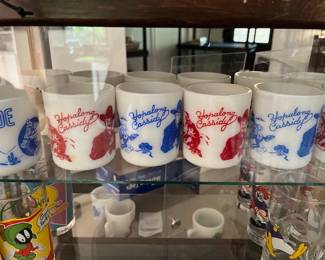 Great collection of milk glass Hopalong Cassidy mugs, red, blue, green and black.  (1950's)