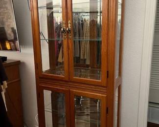 Vintage, lighted display cabinet with glass shelves