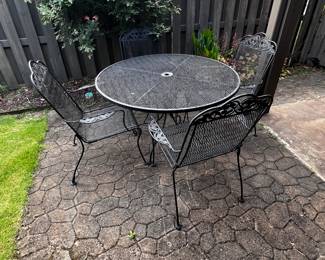 Wrought iron table with 6 chairs