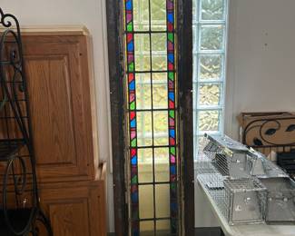 Antique Stained Glass Window Heavy metal framed. Reportedly from a church built in the 1800’s.