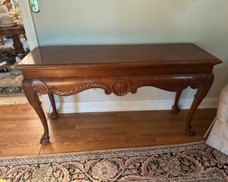 Wood carved accent console table with shell motif and claw feet 