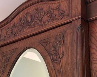 Beautiful Antique Wardrobe closet with carved accents and oval mirror