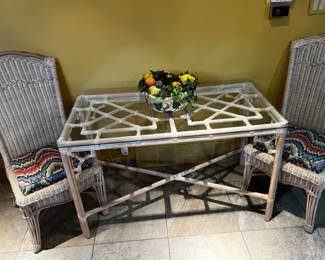 GLASS, BAMBOO AND RATTAN TABLE AND TWO CHAIRS