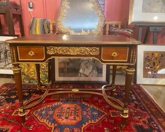 Beautiful early 20th century French leather top guilt Bronze desk. Sign Paris on the bottom with hidden drawer. Lock and key