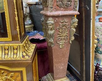 A pair of 20th century, red marble and bronze pedestals