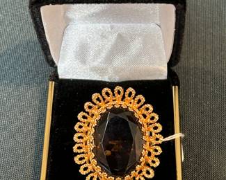 14k gold and gemstone ring.