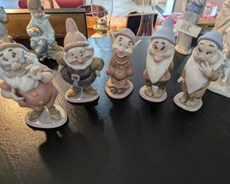 Five of the Seven Dwarfs - DOPEY = $400 - personally signed by J. Lladro  at Official Disneyana Convention 1994. Others are $300 - $400.