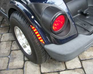 Driver's side back Bumper and tire.