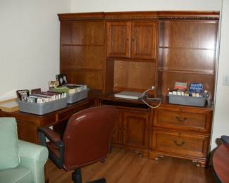 "L" Shaped Executive Desk with Bookcase Hutch Style top. Burgundy Color Desk Chair.