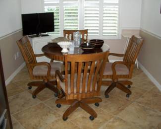 Green Wood and Lumber Co.: 42" Round Wood Table with 4 Chairs on Casters and 1 - 24" Leaf.
