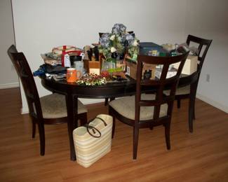 Stanley Furniture - 50" Round Cherry Table with 4 Chairs shown with Leaf in. Leaf measures 18".