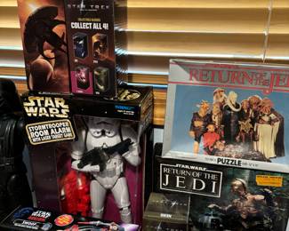 Assortment of 2009 Star Trek Drinking Glass, 1997 Star Wars Stormtrooper Room Alarm Laser Target Game, 1996 Kenner Star Wars Shadows Of The Empire Swoop Vehicle with Trooper, 1983 Star Wars Return of the Jedi 70 Piece Puzzle, Return of the Jedi Cassette Tape Tote