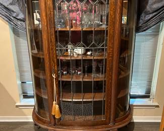 Turn of the Century late 1800's Tiger oak curio with leaded glass and Lion paw feet. Beautiful!