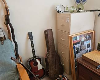 $10 File cabinet.  SOLD walking sticks & Guitars