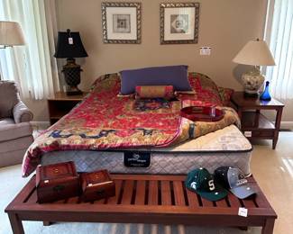 Wooden Bench, Hekman Single Drawer Nightstand, Urn Style Lamp, Serta Perfect Sleeper Queen Mattress, Queen Size Mattress Frame, Metal Wall Art, Duvet with Cover, Throw Pillows, Opaque Floral Lamp, Blue Glass Decanter

